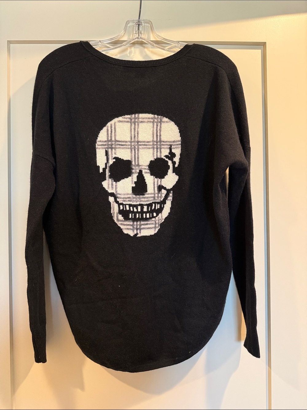 Skull Cashmere oversized v neck sweater with Glen plaid skull on back.